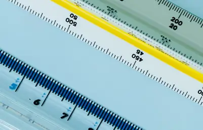 Architects reviewing measurements on a floor plan