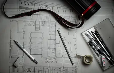 Construction professional reviewing architectural drawings