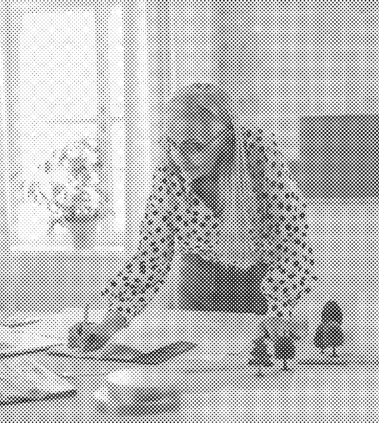 An architect reviewing plans at her desk