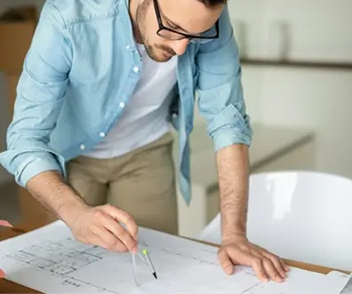 An estimator discussing plans with a client