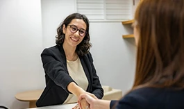 A professional greeting a candidate