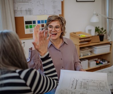 An estimator discussing plans with a client